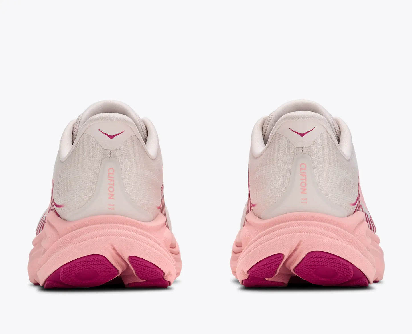 Pink and gray running shoes with visible Nike logo on a white background