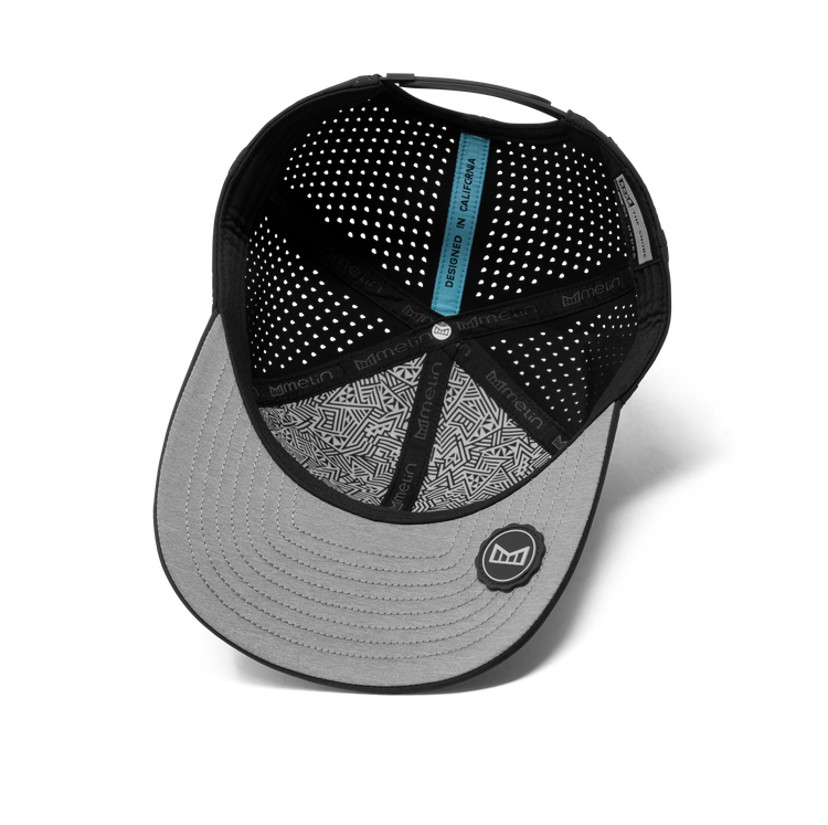 Black and gray cap with patterned visor on a white background