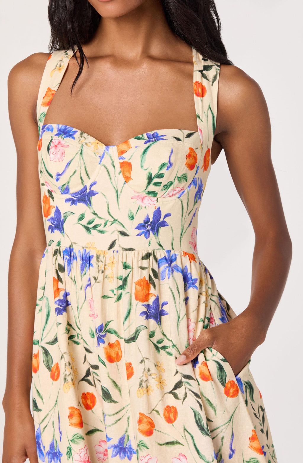 Woman wearing a floral dress with a white background