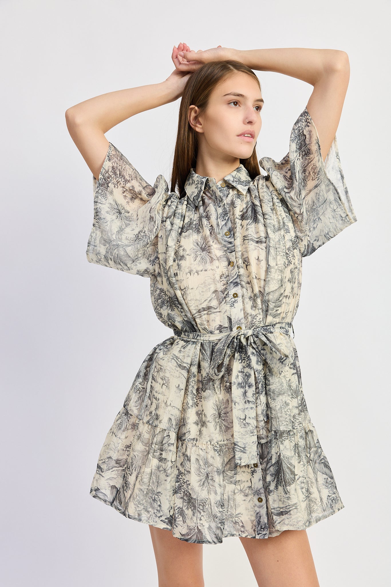 Woman wearing a floral dress on a white background