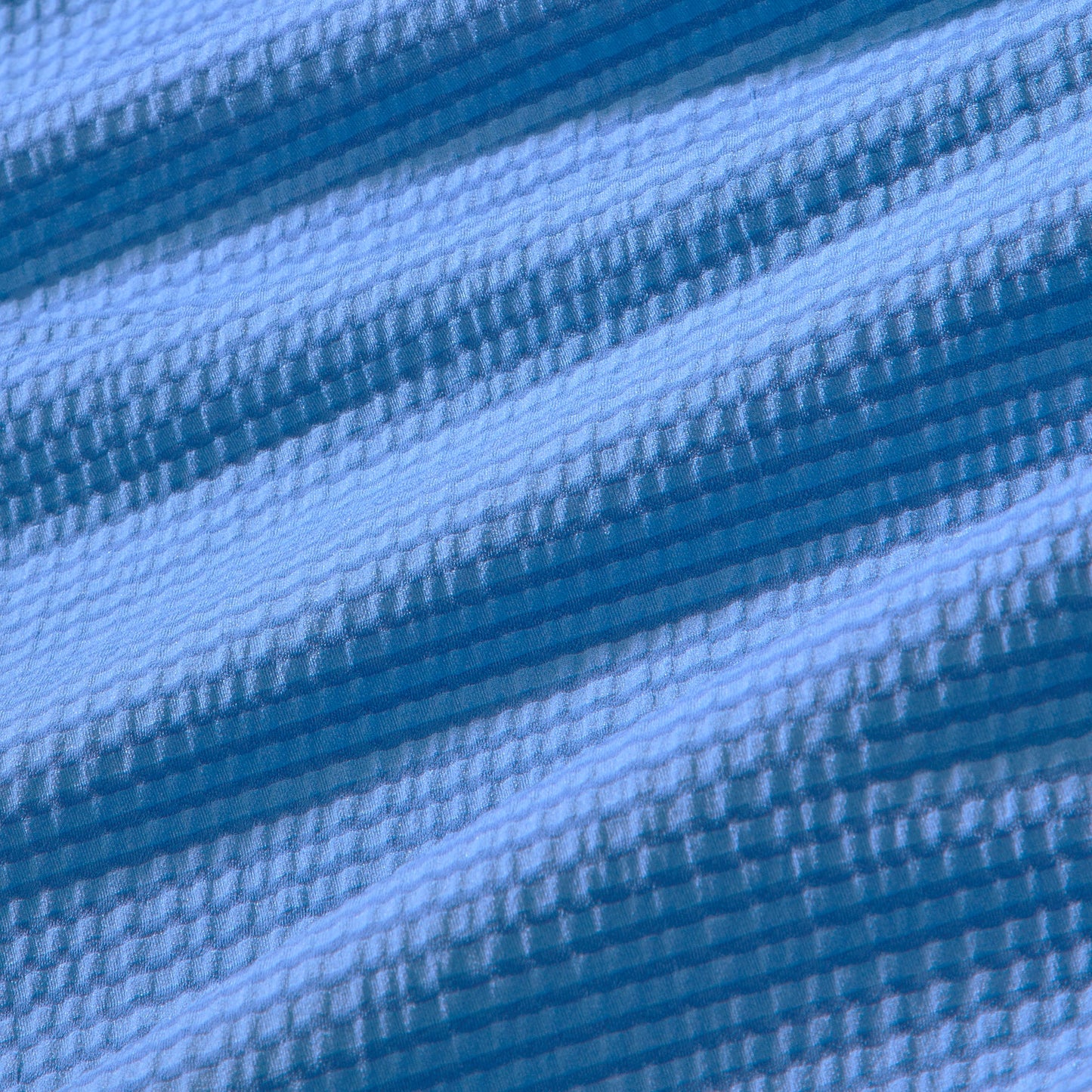 Close-up of blue fabric with horizontal stripes