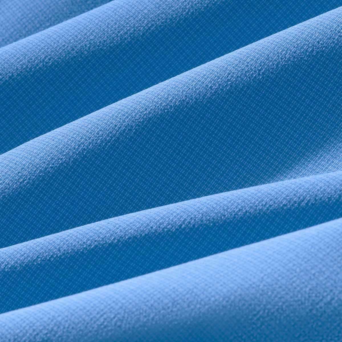 Close-up of blue fabric with a textured pattern