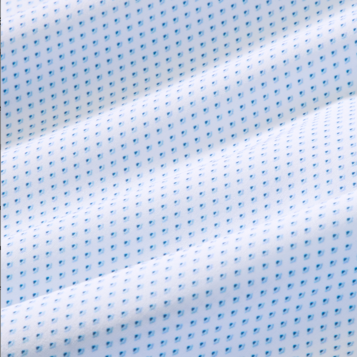 Close-up of white fabric with small blue patterns