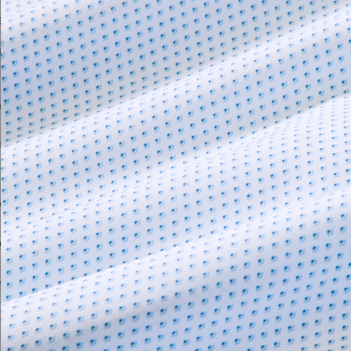 Close-up of white fabric with small blue patterns